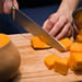 Chopping butternut squash.